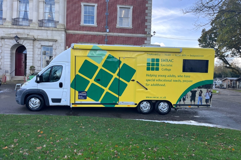 swrac-van-2025 A SWRAC branded van parked outside a large, old manor house